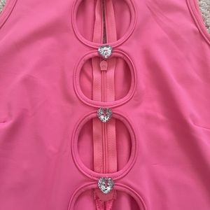 Never worn before, Ediked Body suit. Pink, Size Medium, Tag still on.